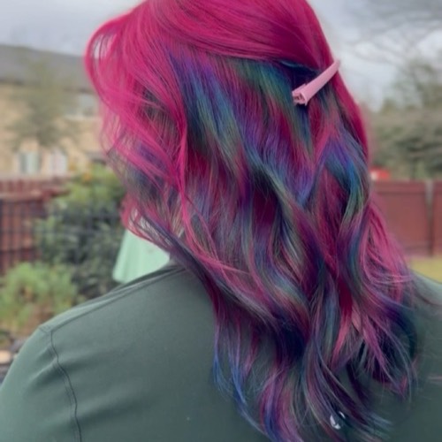 Magenta hair with oil slick blue and teal underneath